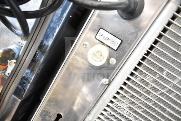 Avantco Commercial Ice Head on 2025 Avantco 194BIN23022, ice water inlet label visible, sturdy stainless construction.