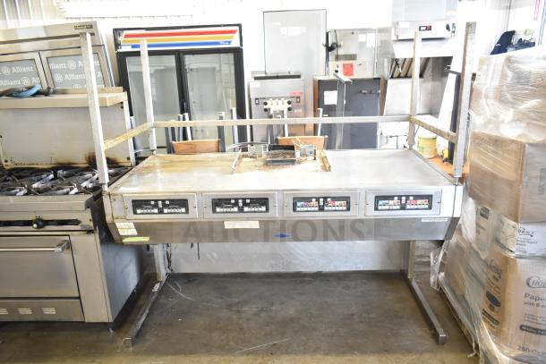 Frymaster BKFP450C Commercial Hood for Fryer, stainless steel, used condition, with control panels and mounting brackets.
