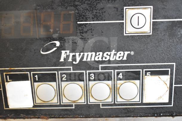 Frymaster BKFP450C commercial fryer hood control panel with label, numeric buttons, and visible wear.
