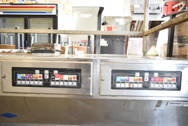 Frymaster BKFP450C Commercial Fryer Hood, stainless steel, dual control panels, some surface wear, with operational labels.