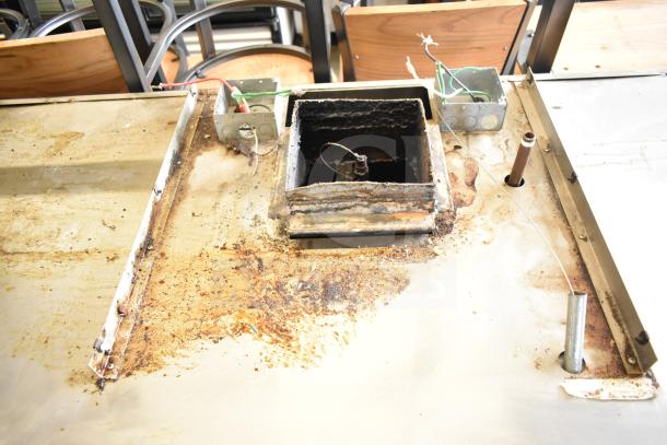 Frymaster BKFP450C commercial fryer hood, visible wear and rust, model tag intact, electrical components exposed.