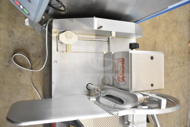 Bizerba A 404 US Commercial Meat Slicer Stacker in excellent condition, 115 volts, 1 phase. Visible safety label.