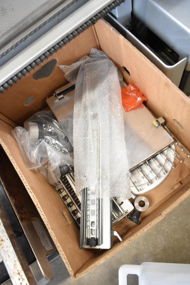 Bizerba A 404 US Commercial Countertop Meat Slicer parts in box, 115 volts, 1 phase, various components, bubble wrapped.