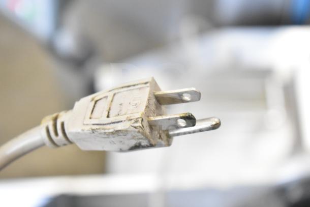 Bizerba A 404 US Commercial Meat Slicer Stacker plug, 115V, 1 Phase, showing prongs and worn condition.