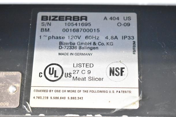 Bizerba A 404 US Commercial Countertop Meat Slicer label showing model, voltage, and certifications. Made in Germany.
