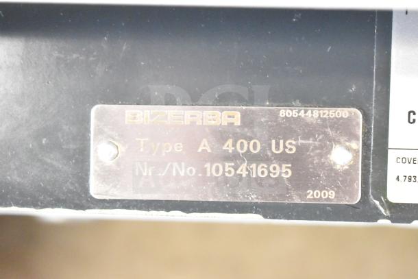 Bizerba A 404 US meat slicer tag showing model and serial no. 10541695, manufactured in 2009.