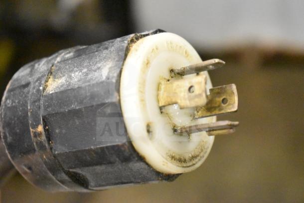 Close-up of an electrical plug on a CookShack 250 Commercial Electric Smoker. Power rating: 208 Volts.