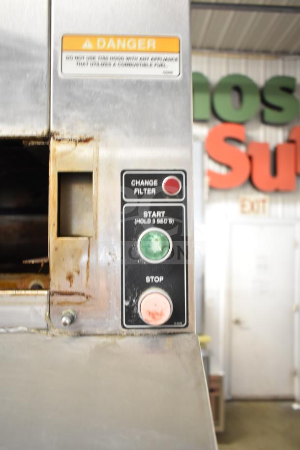 BKI commercial hood with control panel. Features filter change, start, and stop buttons. Warning label visible. Good condition.