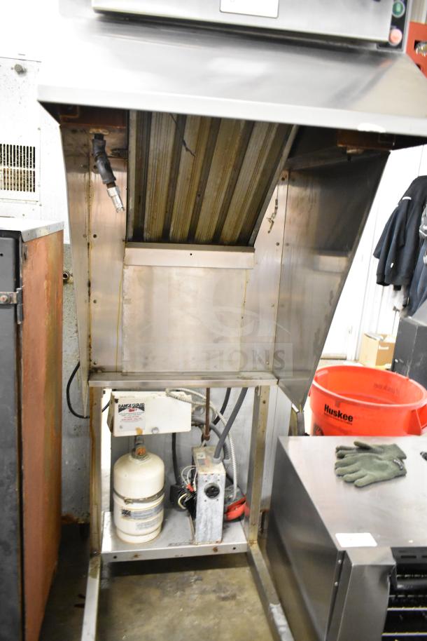 BKI Commercial Hood, stainless steel, featuring ventilation components and visible piping, shows moderate wear.