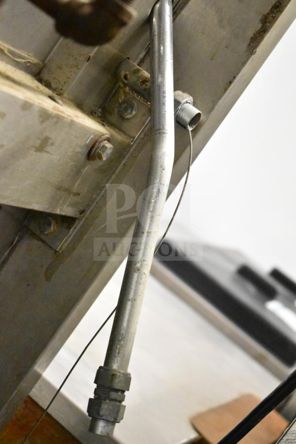 BKI Commercial Hood, metal construction, visible bolts and fittings, showing industrial wear.