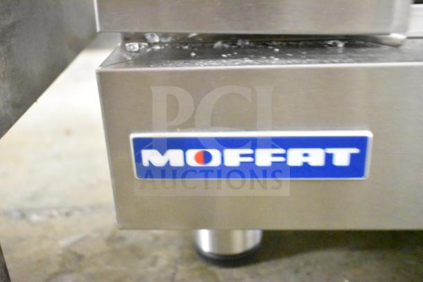 Moffat E27M3 convection oven with visible Moffat logo, 208V, 1 phase. Note broken glass detail.
