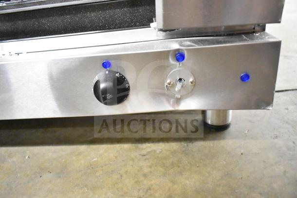 Moffat E27M3 convection oven control panel showing knobs and indicators. Note: oven features broken glass.