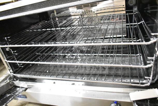 Moffat E27M3 commercial countertop electric convection oven with interior racks visible, broken glass noted, 208V, 1 phase.