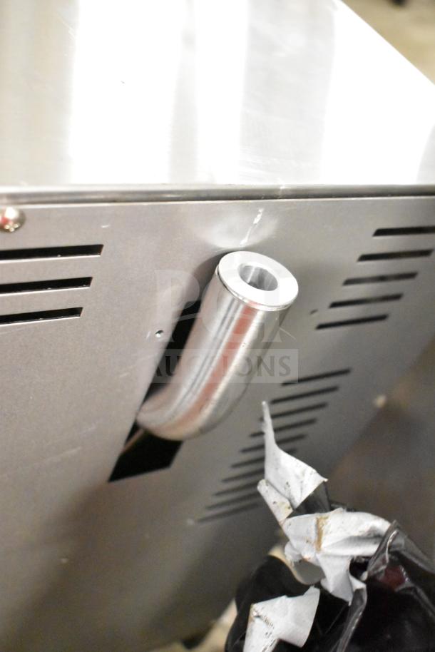 Moffat E27M3 convection oven showing side view of stainless steel exterior and ventilation. Note: broken glass not visible here.