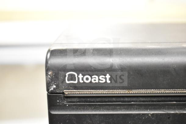 Toast TP200 receipt printer, used condition with visible wear, part of a 4-item auction including Crown and Speco amplifiers, Samsung DVR.