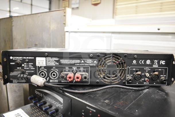 Crown XLS 1500 Power Amplifier, Speco Technologies PBM120A Amplifier, rear panel with inputs and outputs visible.