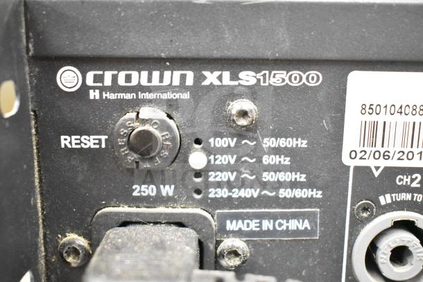Crown XLS 1500 power amplifier back panel with reset button, voltage settings, and "Made In China" label.
