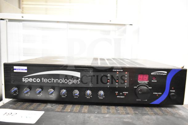 Speco Technologies PBM120A Amplifier, black, front view with knobs and digital display, in used condition.