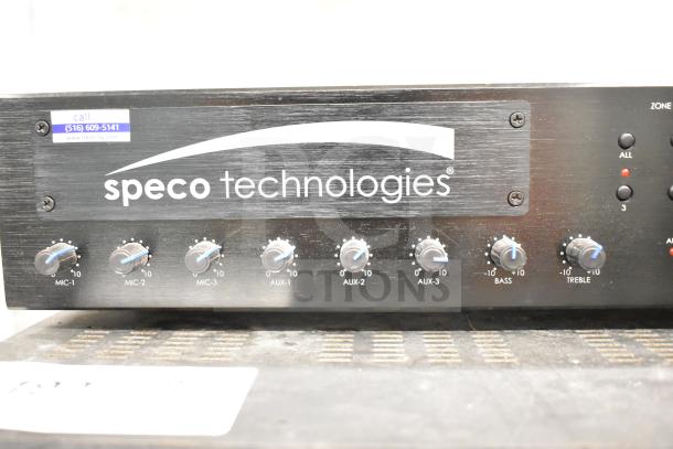 Speco Technologies PBM120A Amplifier, featuring multiple knobs for microphone and auxiliary inputs, in used condition.