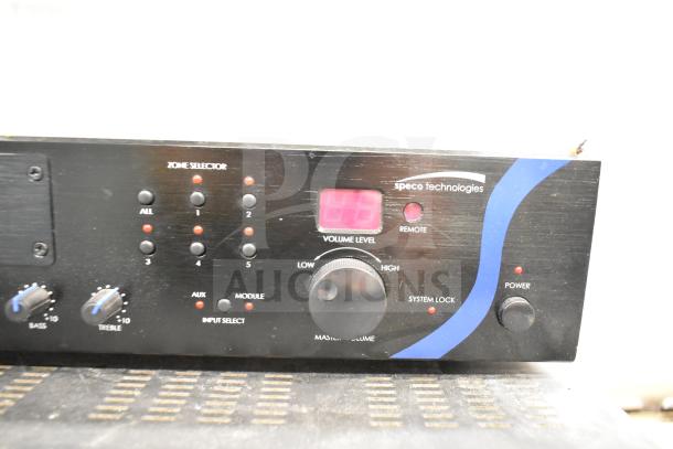 Speco Technologies PBM120A Amplifier, black front panel with volume and selector controls visible.