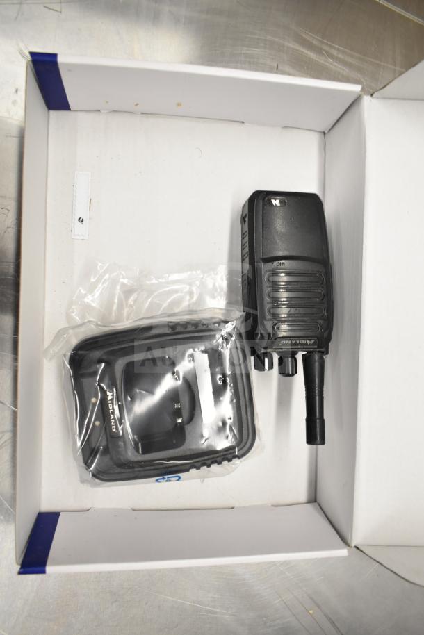 Biztalk BR200 Business Band Two Way Radio in original packaging with accessories. Black housing, new condition.