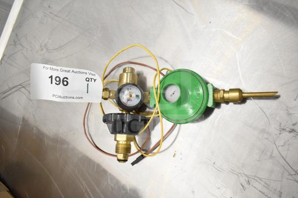 Pressure gauge set with green Zephyr regulator, brass fittings, and hoses. Auction tag indicates quantity of one.