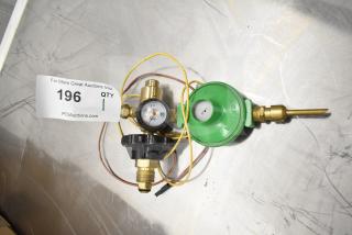 Pressure gauge set with green Zephyr regulator, brass fittings, and hoses. Auction tag indicates quantity of one.