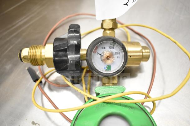 Pressure gauge with brass fittings, black adjustment dial, and psi markings up to 3000. Zephyr brand label visible.