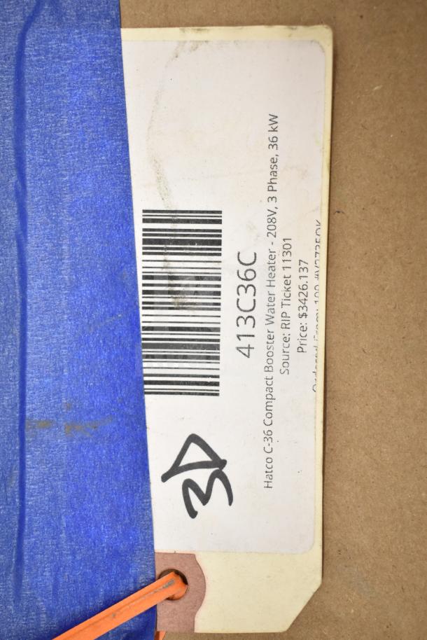 Tag attached to item; reads "Hatco C-36 Compact Booster Water Heater - 208V, 3 Phase, 36 kW." Blue tape partially covers barcode.