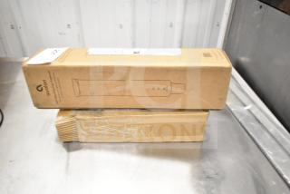 Two brand new Avalon items in boxes: a Self Adjusting Cup Dispenser and Filter Cartridges; with signs of scratches and dents.