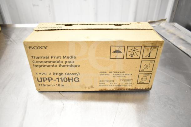 Sony UPP-110HG Thermal Print Media box, Type V High Glossy, 110mm x 18m. Features symbols and bilingual labels.