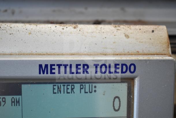 Mettler Toledo countertop food portioning scale, showing "Enter PLU" on display. Tested and working condition.