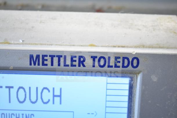 Mettler Toledo countertop food portioning scale, tested and working, no power cord included. Display shows Mettler Toledo branding.