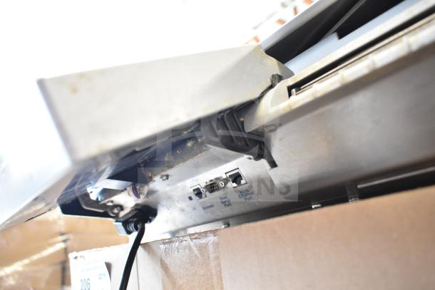 Mettler Toledo countertop food portioning scale, ports visible, tested working condition. Power cord not included.