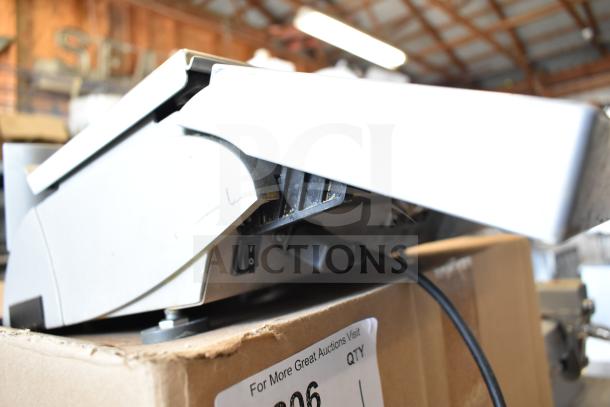 Mettler Toledo countertop food portioning scale on a box, missing power cord, tested and working condition.