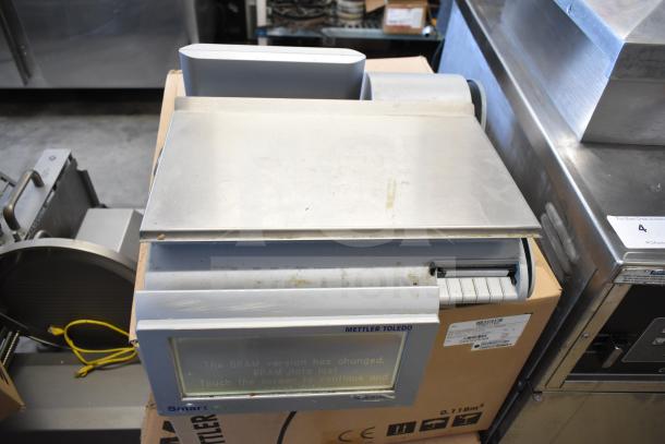 Mettler Toledo countertop food portioning scale, tested and working, lacks power cord. Slight wear visible.