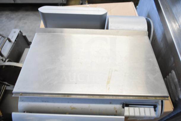 Mettler Toledo countertop food portioning scale, stainless steel, no power cord, tested and working.