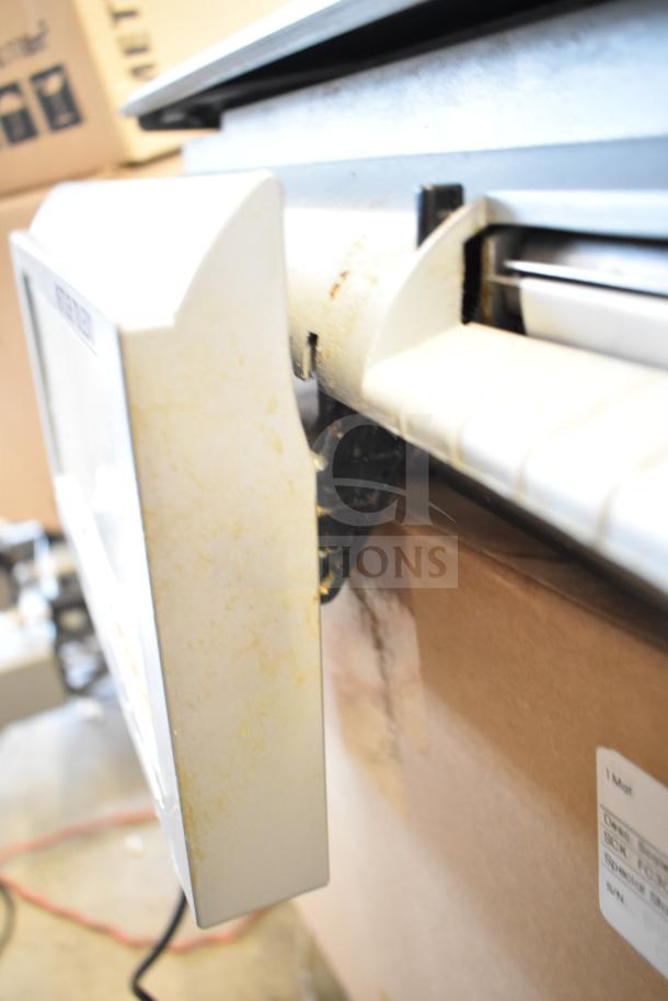 Mettler Toledo countertop food portioning scale, tested and working, no power cord included.