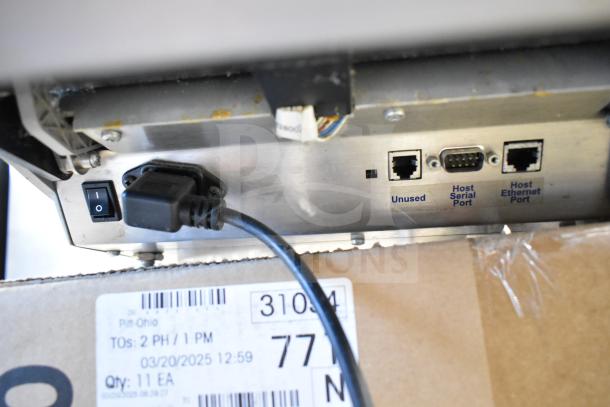 Mettler Toledo countertop food portioning scale, tested and working, missing power cord. Includes host serial and ethernet ports.