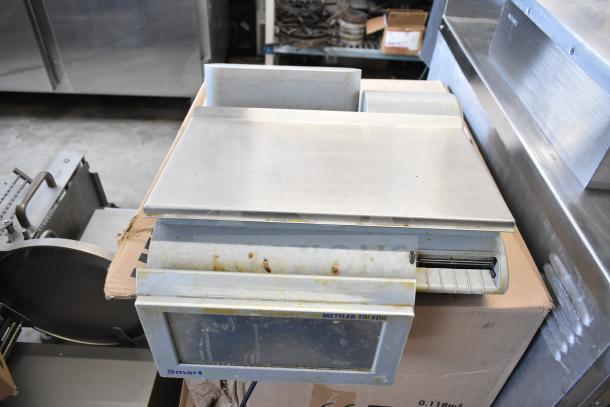 Mettler Toledo countertop food portioning scale, no power cord, tested non-functional, visible wear and markings.