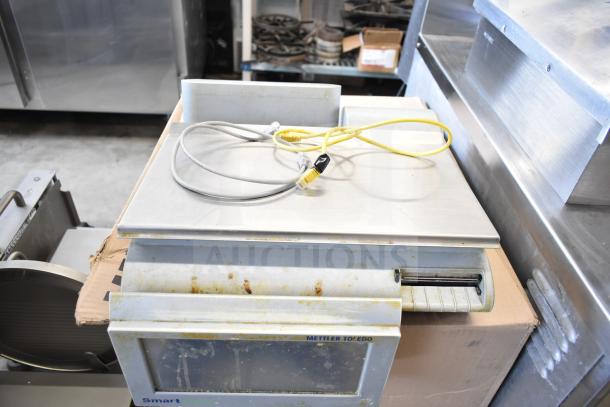 Mettler Toledo countertop food portioning scale, no power cord, tested non-functional, some rust present.