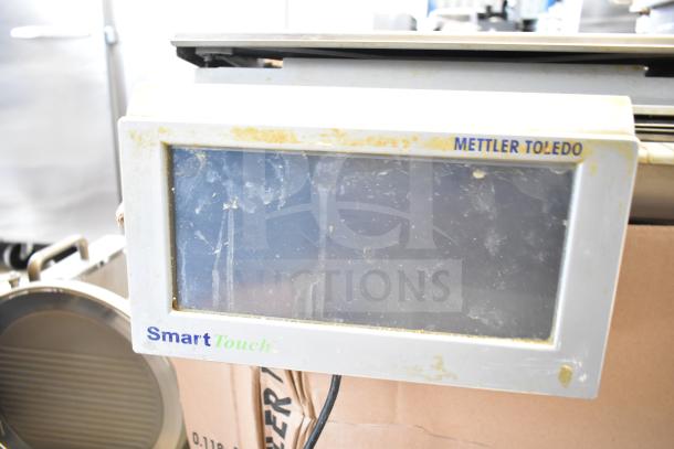 Mettler Toledo countertop food portioning scale with SmartTouch display. No power cord; tested and does not power on.
