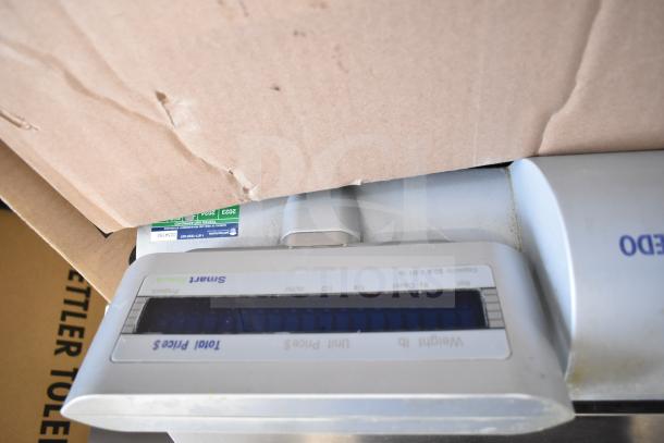 Mettler Toledo countertop food portioning scale, no power cord, tested but not powering on, visible display and labels.