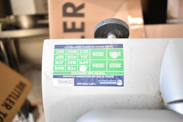 Mettler Toledo countertop food portioning scale, lacking power cord, unable to power on. Serial number 0254160. Inspection sticker visible.