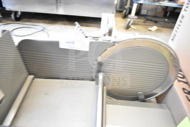 Jaccard VA2000GRT Commercial Automatic Meat Slicer, 110V, 1 Phase, visible blade and tray, used condition.