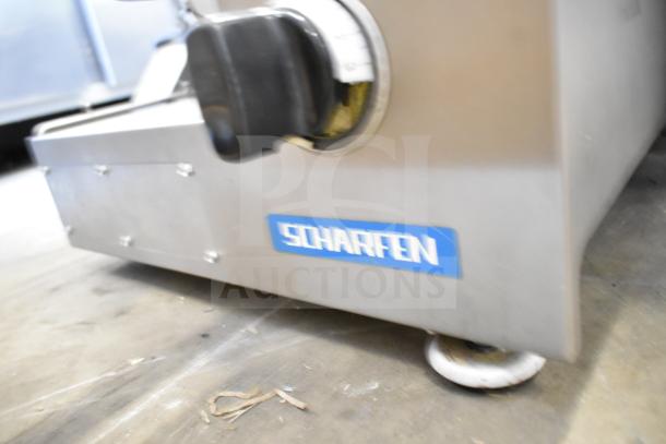 Scharfen VA2000 GR commercial automatic meat slicer stacker, 110V, features a stainless steel body and Scharfen logo.