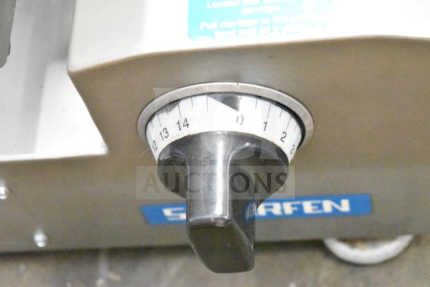 Scharfen VA2000 GR commercial meat slicer dial showing thickness settings, with brand label visible.