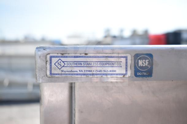 Southern Stainless Equipment Co counter with label, featuring two red doors. NSF certified, stainless steel construction.