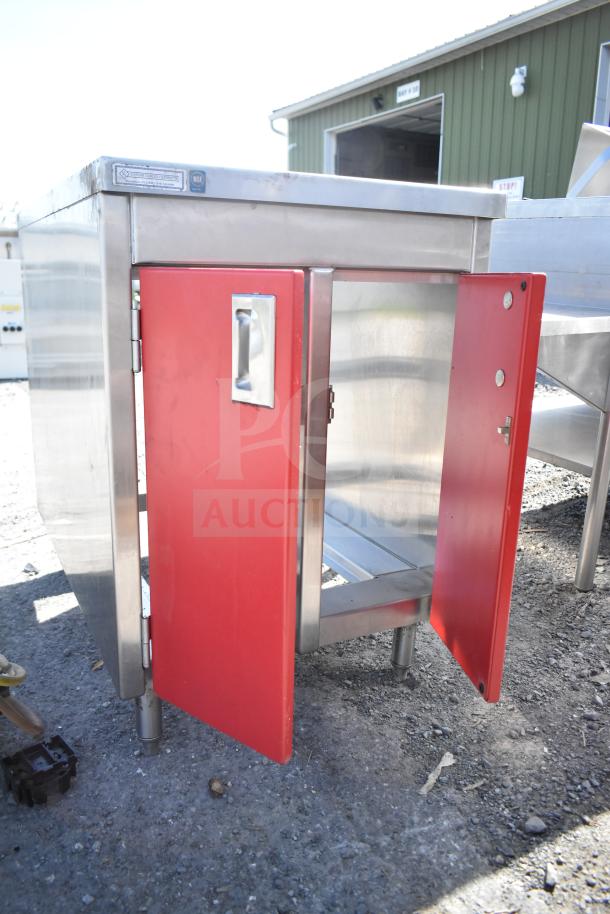 Southern Stainless Equipment Co counter with two red doors, stainless steel build, and polished handles, in good condition.