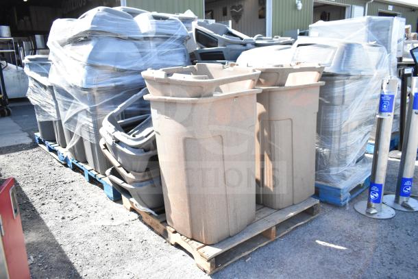 Three large beige poly trash cans with extra lids on wooden pallets, wrapped for shipping. Ideal for bulk waste management.